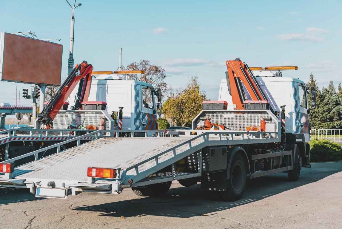 Flatbed tow trucks parked and ready for service in West Islip, NY