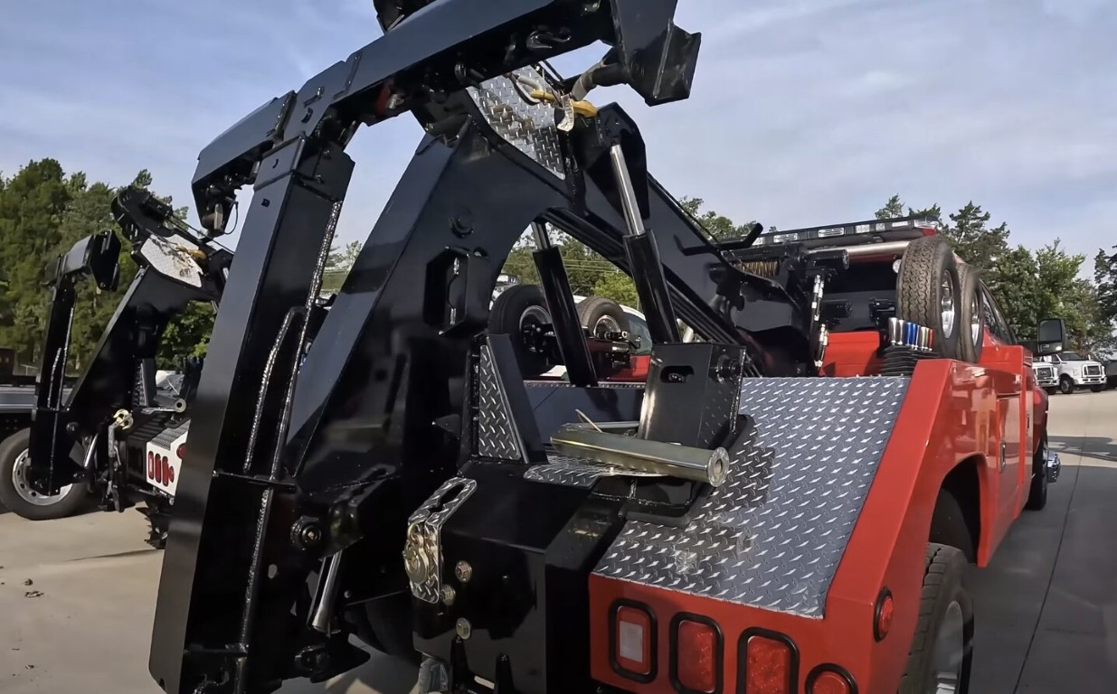 Tow truck technician equipment close-up for flat tire change service